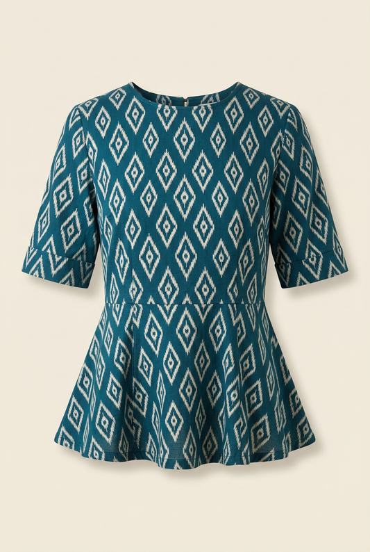 Deep-teal peplum top with ivory diamond motifs, round neckline and elbow-length sleeves