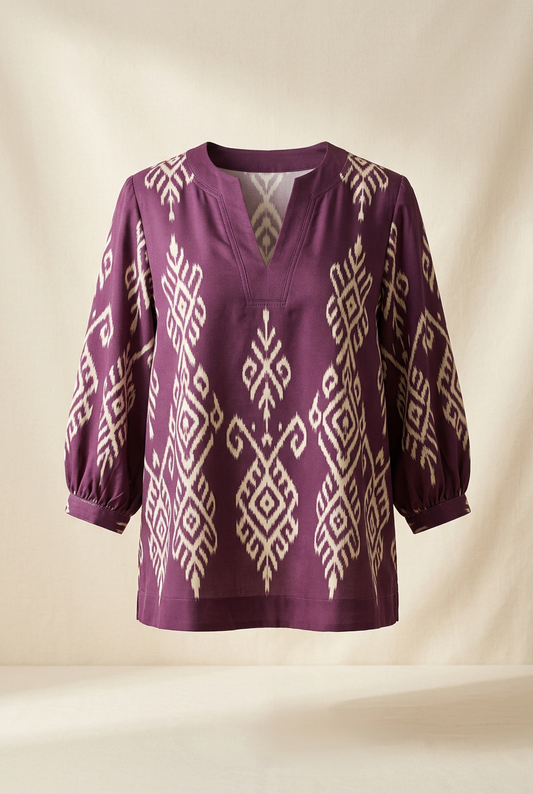 Plum-purple blouse with ivory geometric motifs, V neckline and gathered three-quarter sleeves
