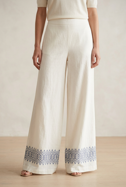 Ivory wide-leg palazzo trousers with an indigo Ikat-inspired hem border