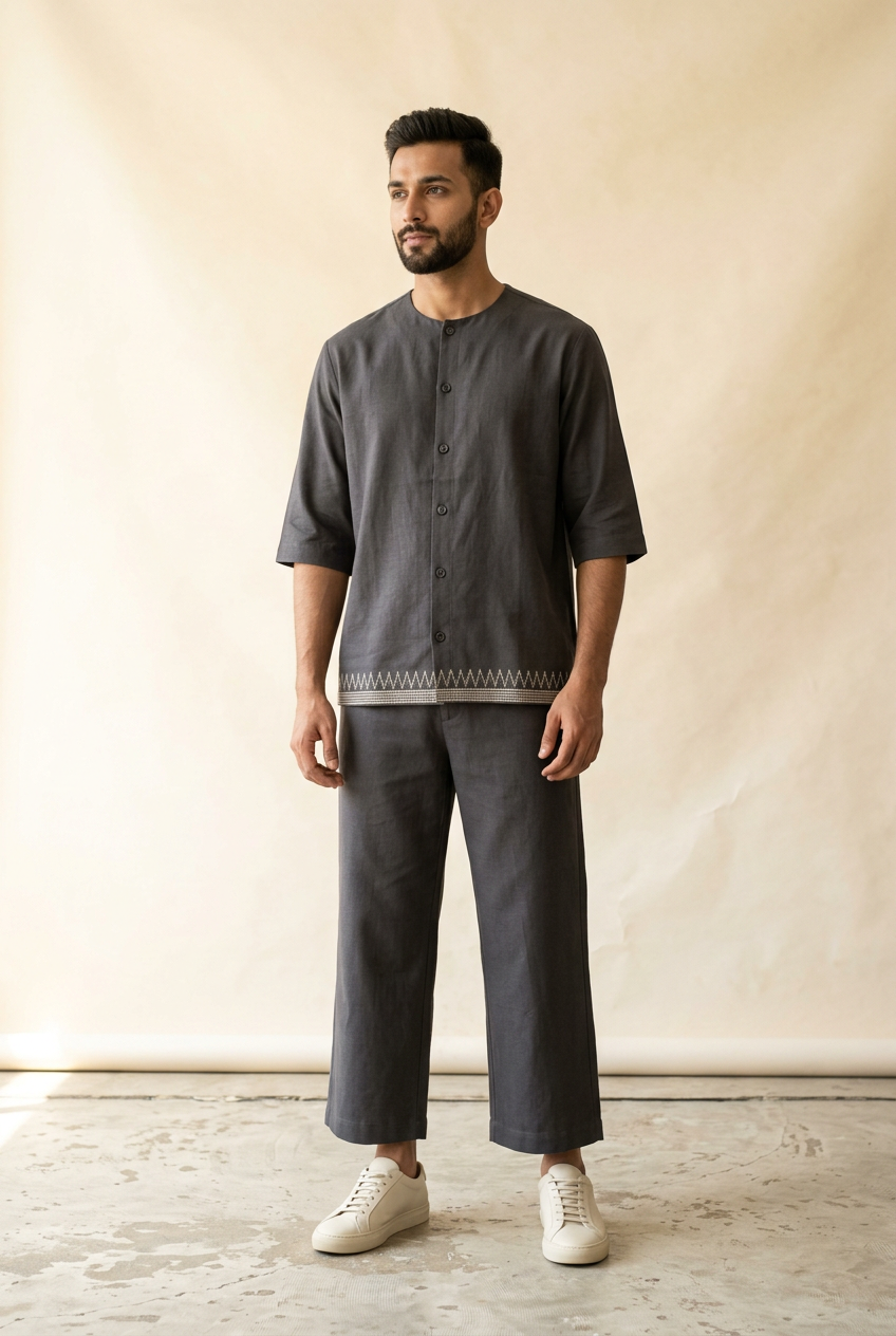 Men's charcoal collarless shirt with ivory Ikat-inspired border and matching cropped wide-leg trousers